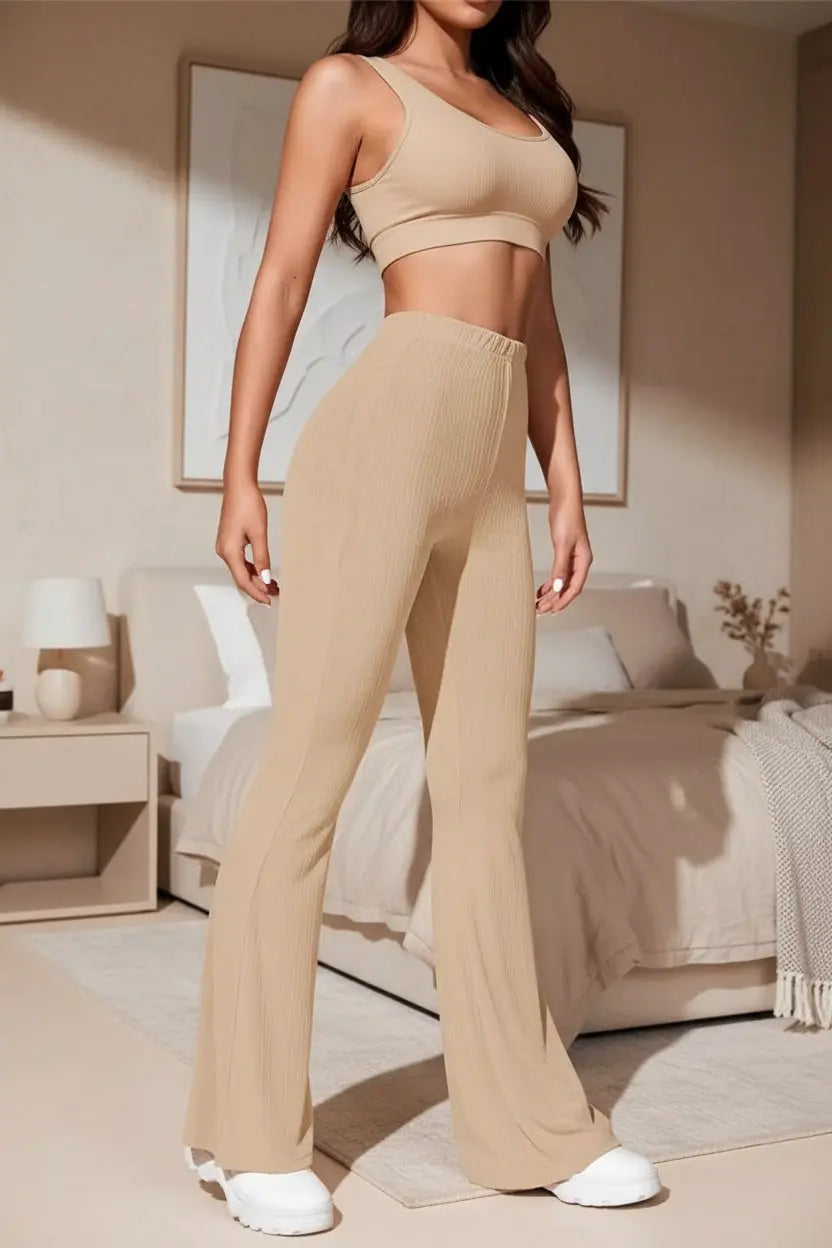 Person wearing beige wide-leg pants with a neutral background