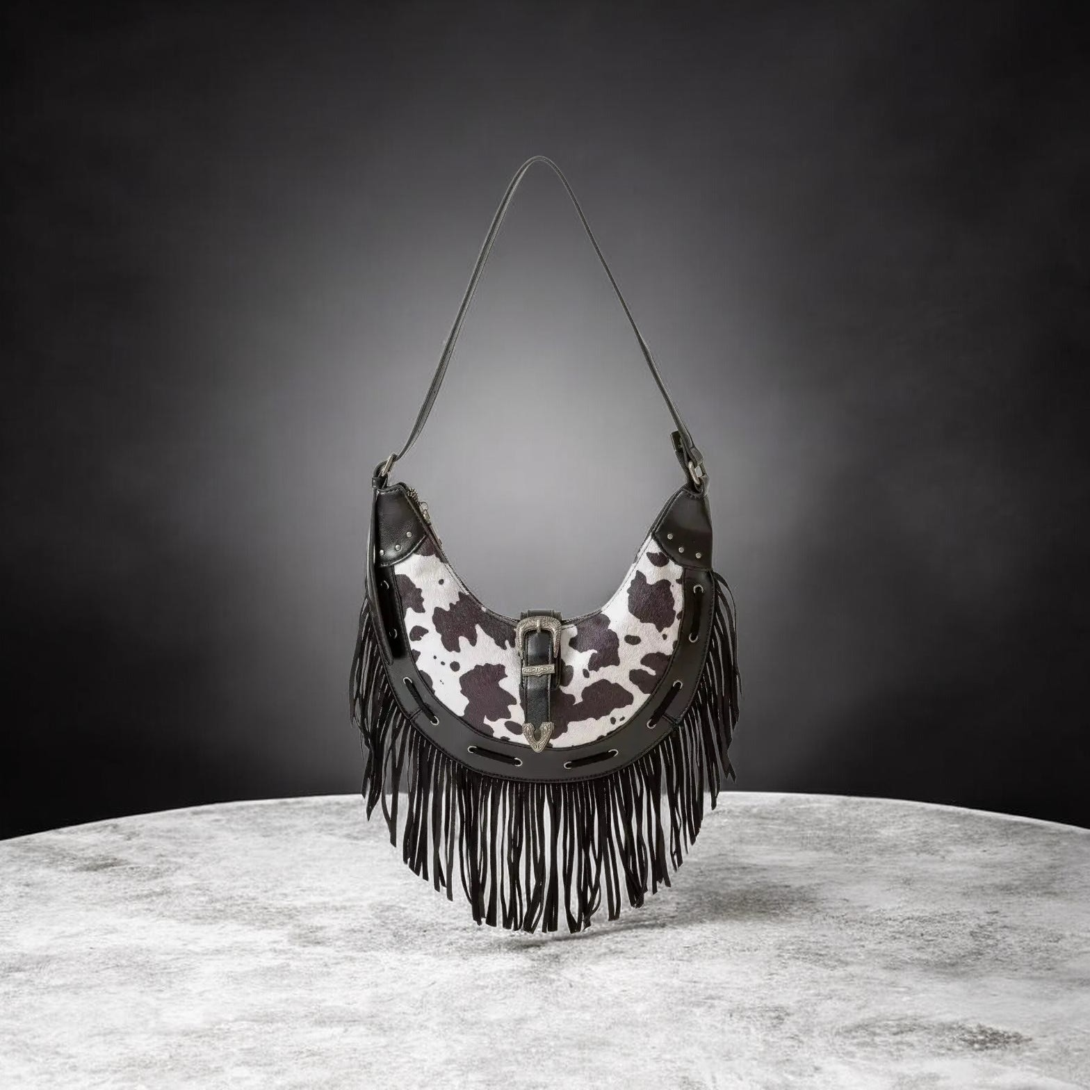 Fame Cow Print Faux Leather Fringe Hobo Bag